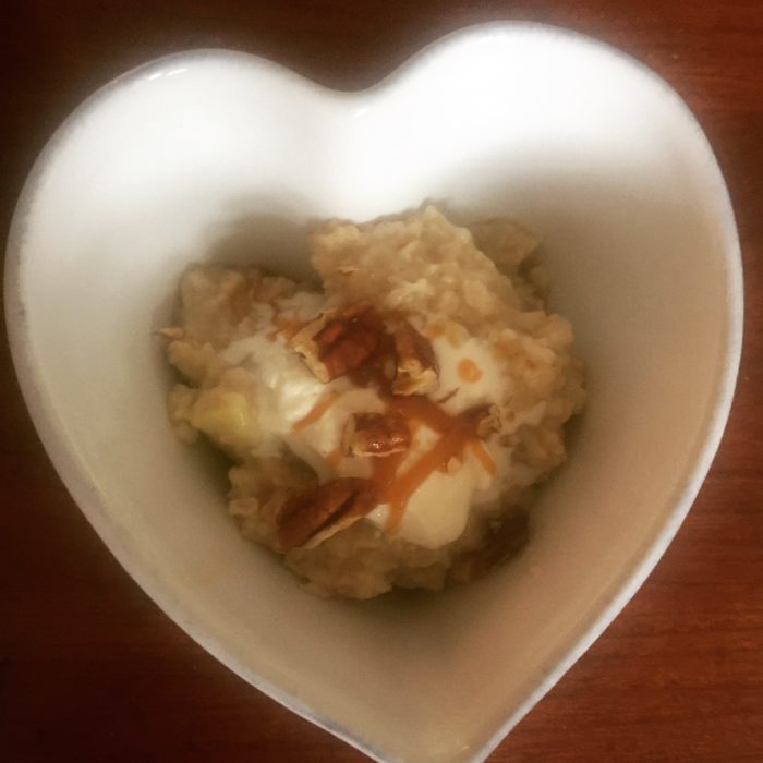 oatmeal or porridge with cooked apples, caramel, creme fraiche and pecans 