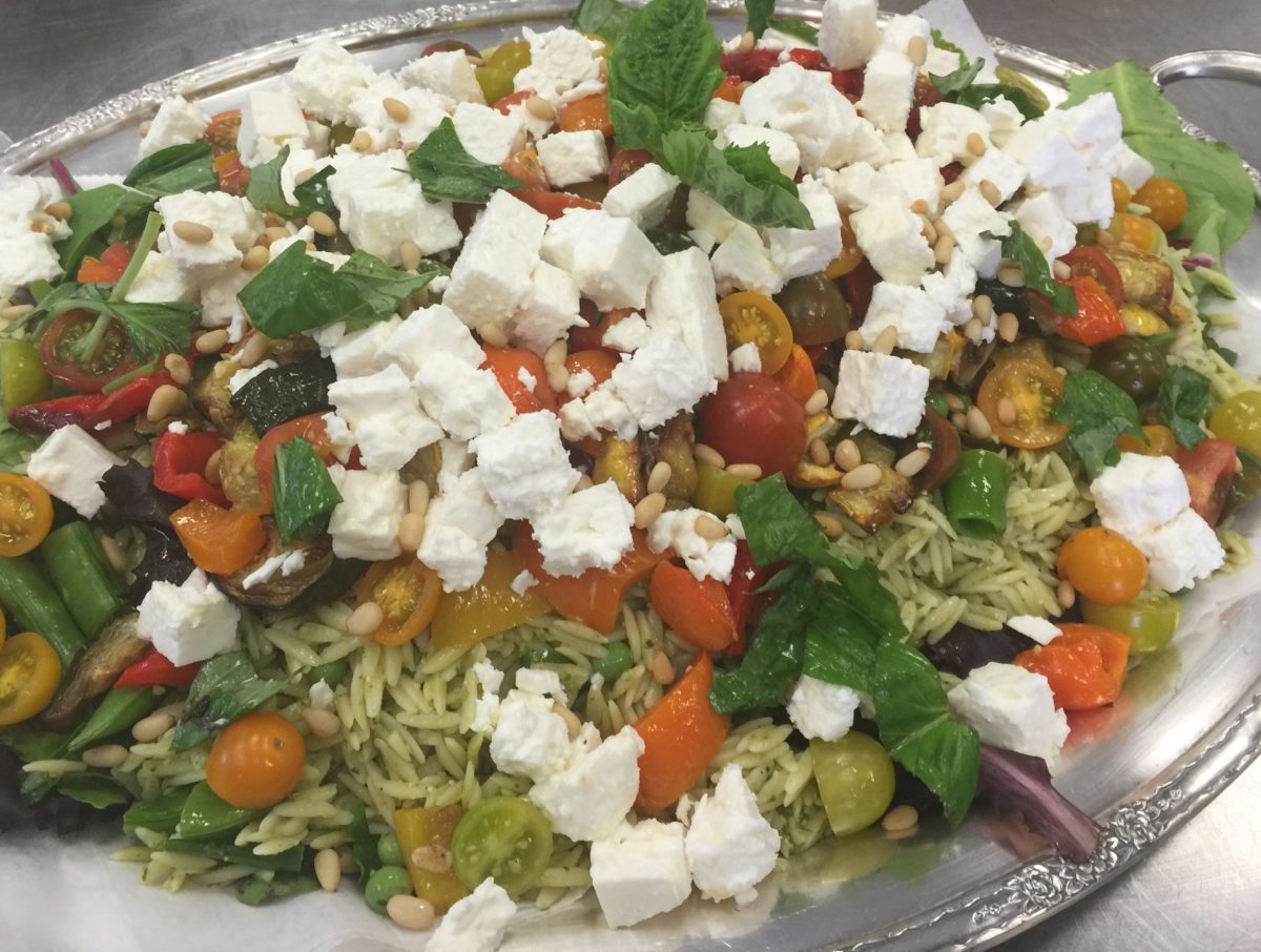 Pesto orzo with roasted vegetables, feta cheese and toasted pine nuts