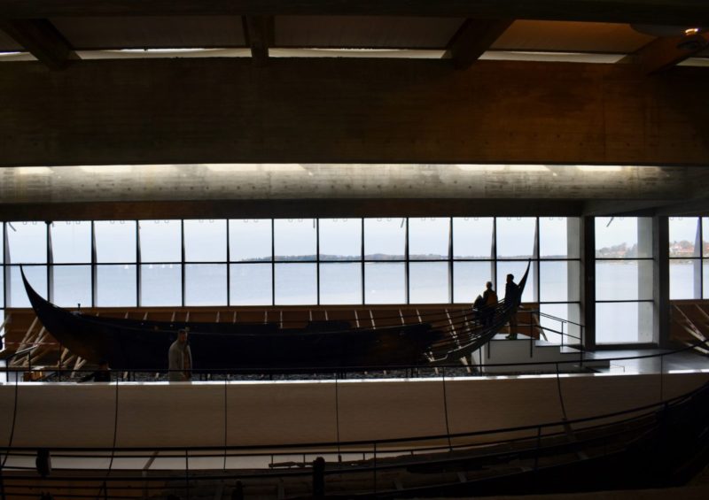 RECONSTRUCTED VIKING LONGBOAT WITH DANISH COAST IN THE BACKGROUND