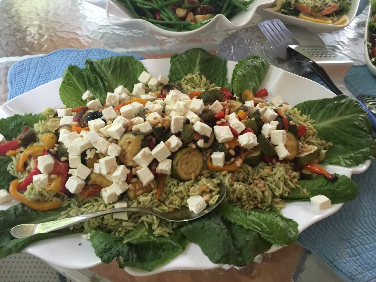 Pesto orzo with roasted vegetables, feta cheese and toasted pine nuts